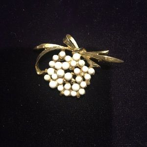 Gold and white pin